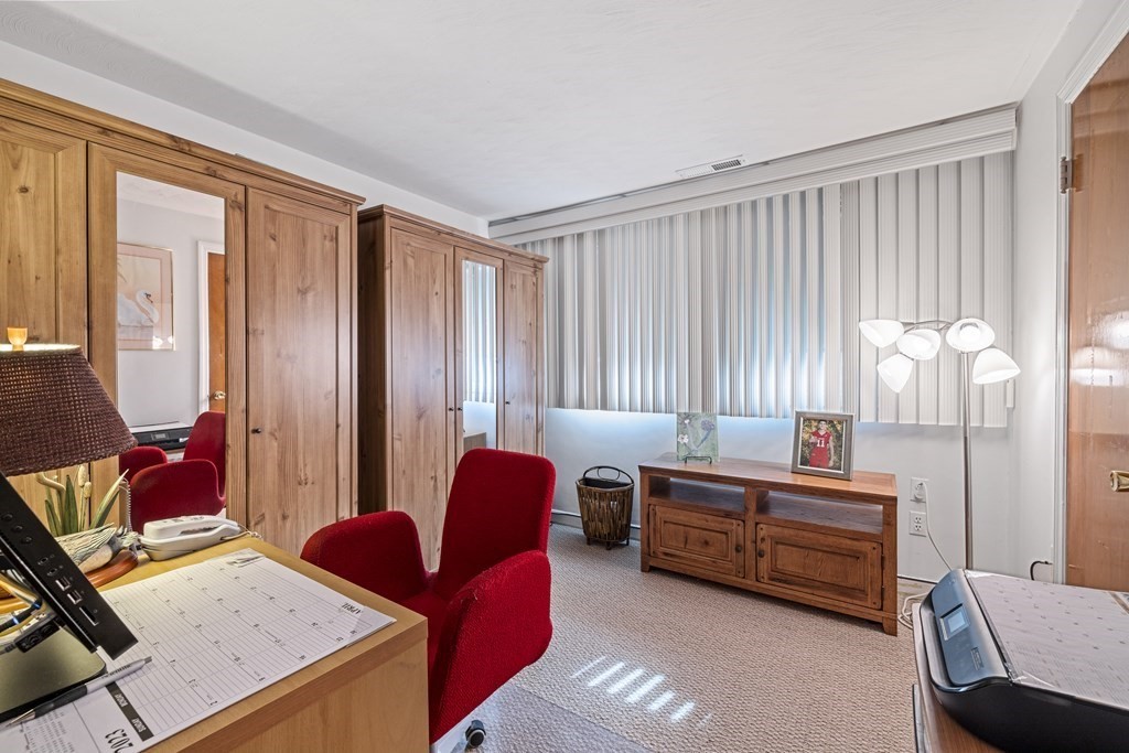 25 Westlake Road Natick, MA 01760 - Photo 15 of 25 a livingroom with workspace and a couch