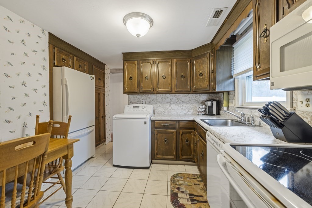 25 Westlake Road Natick, MA 01760 - Photo 8 of 25 a kitchen with a sink appliances cabinets and furniture