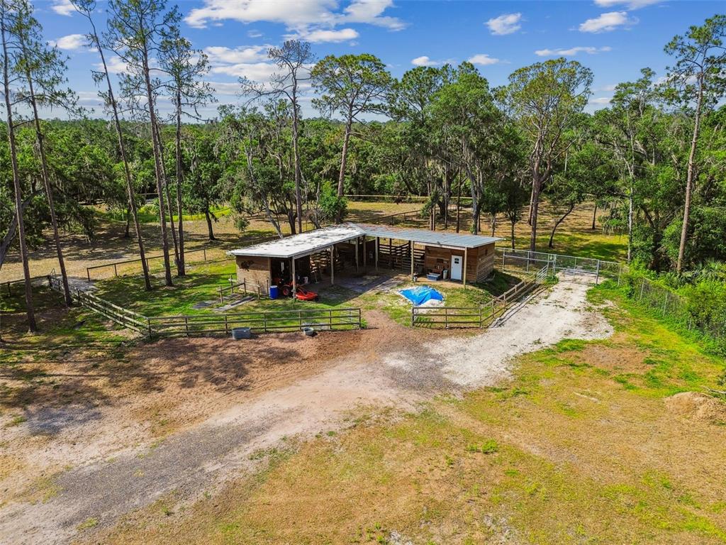 2853 Saffold Road Wimauma, FL 33598 - Photo 52 of 62 a view of a house with swimming pool and sitting area
