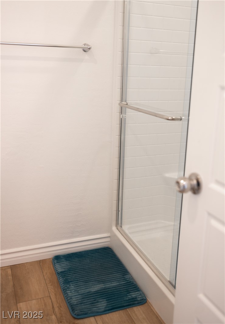 7342 North Decatur Boulevard, Unit 5 North Las Vegas, NV 89084 - Photo 10 of 29 Full bath featuring wood finished floors and a shower stall