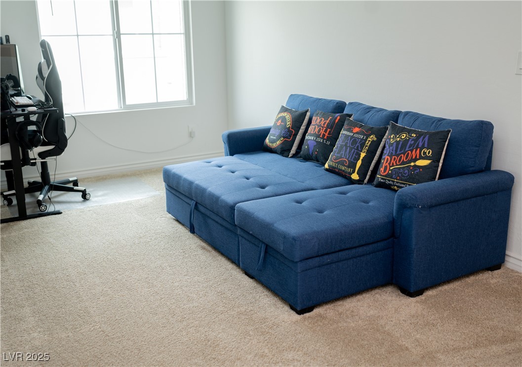 7342 North Decatur Boulevard, Unit 5 North Las Vegas, NV 89084 - Photo 14 of 29 Living room with carpet flooring and baseboards