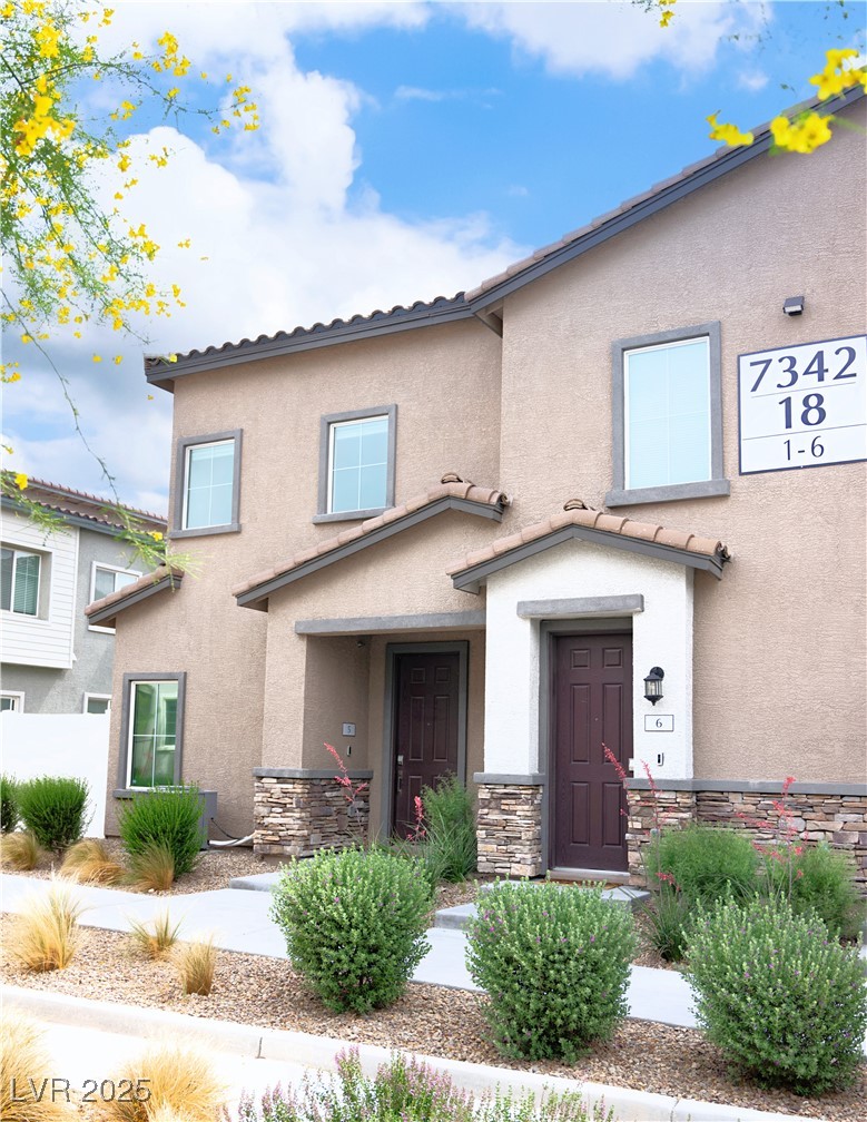7342 North Decatur Boulevard, Unit 5 North Las Vegas, NV 89084 - Photo 2 of 29 View of front facade with stucco siding and stone siding