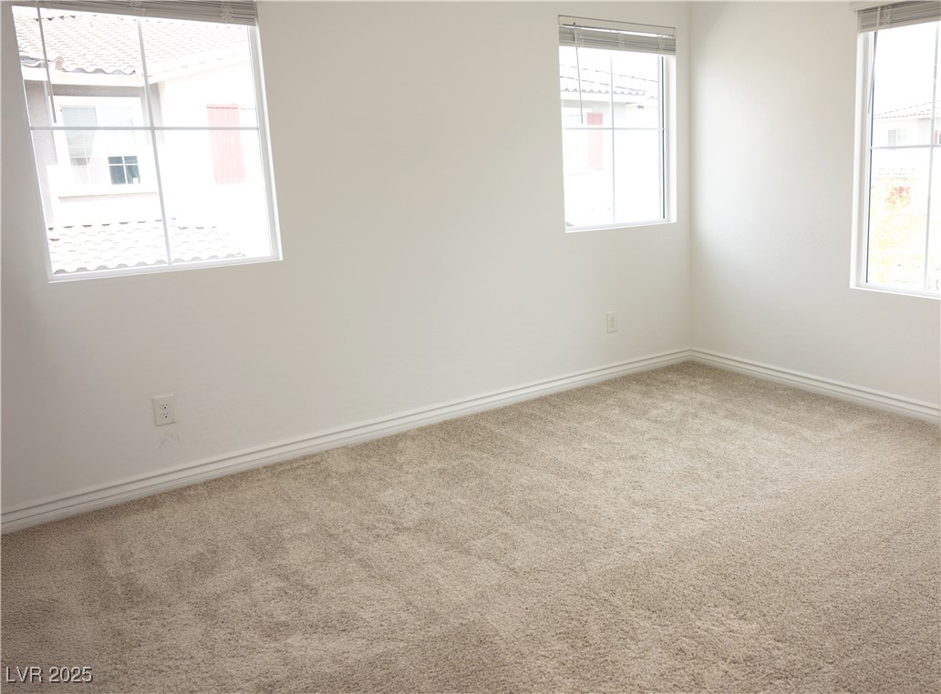 7342 North Decatur Boulevard, Unit 5 North Las Vegas, NV 89084 - Photo 20 of 29 Unfurnished room with carpet flooring and baseboards