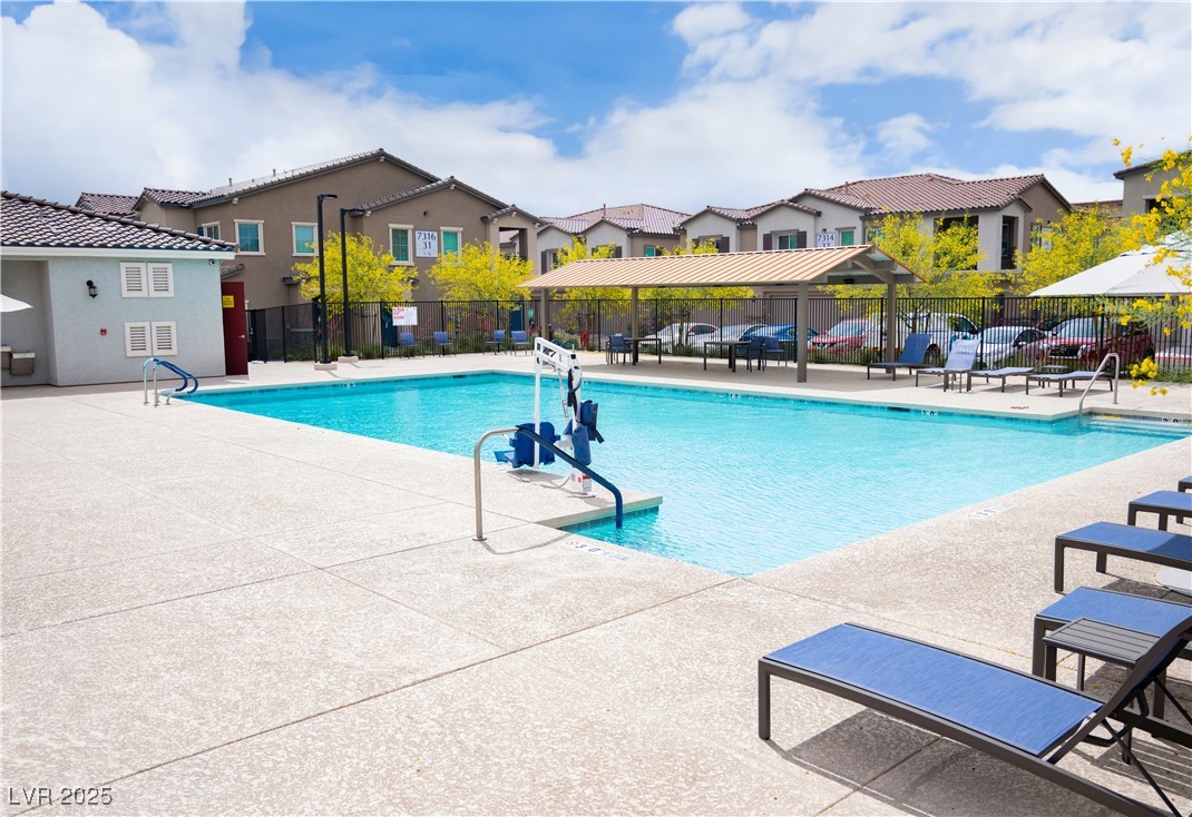 7342 North Decatur Boulevard, Unit 5 North Las Vegas, NV 89084 - Photo 26 of 29 Community pool featuring a residential view and a patio area