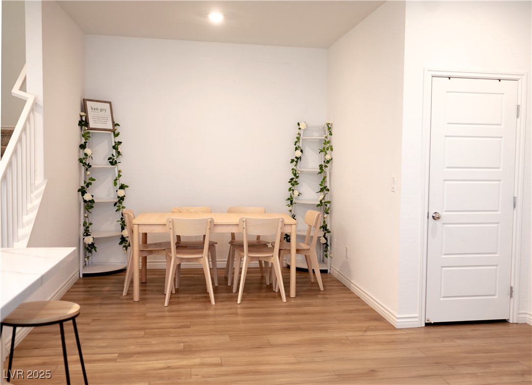 7342 North Decatur Boulevard, Unit 5 North Las Vegas, NV 89084 - Photo 8 of 29 Dining space featuring light wood finished floors and baseboards