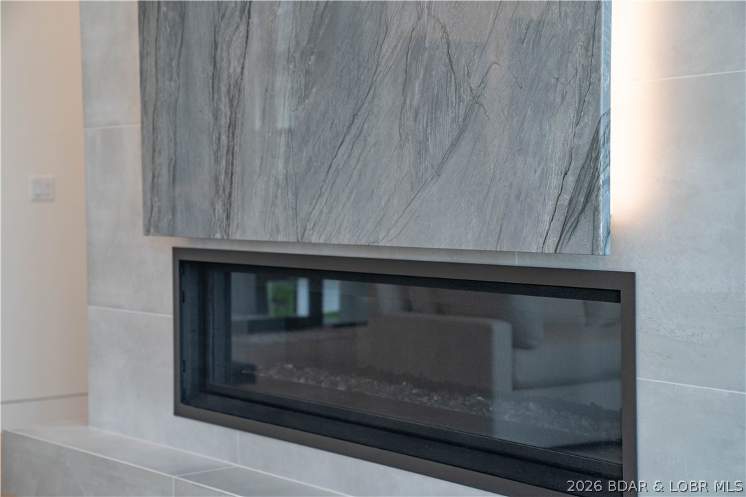 235 East Villages Estates Road Sunrise Beach, MO 65079 - Photo 11 of 64 linear gas fireplace