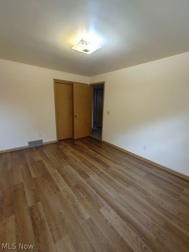 2211 Devonshire Road Northwest Canton, OH 44708 - Photo 25 of 36 Bedroom 4 Unfurnished room featuring hardwood / wood-style floors