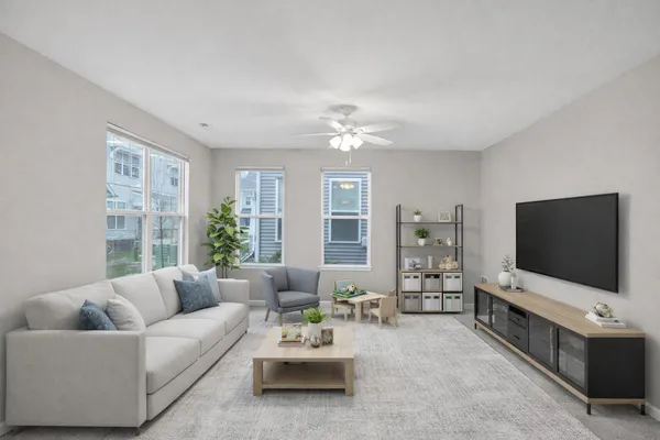 a living room with furniture and a flat screen tv