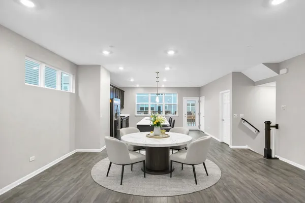 a dining room with furniture and window