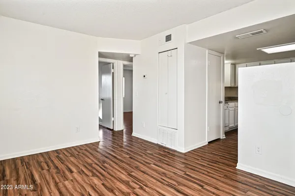 a view of hallway with wooden floor