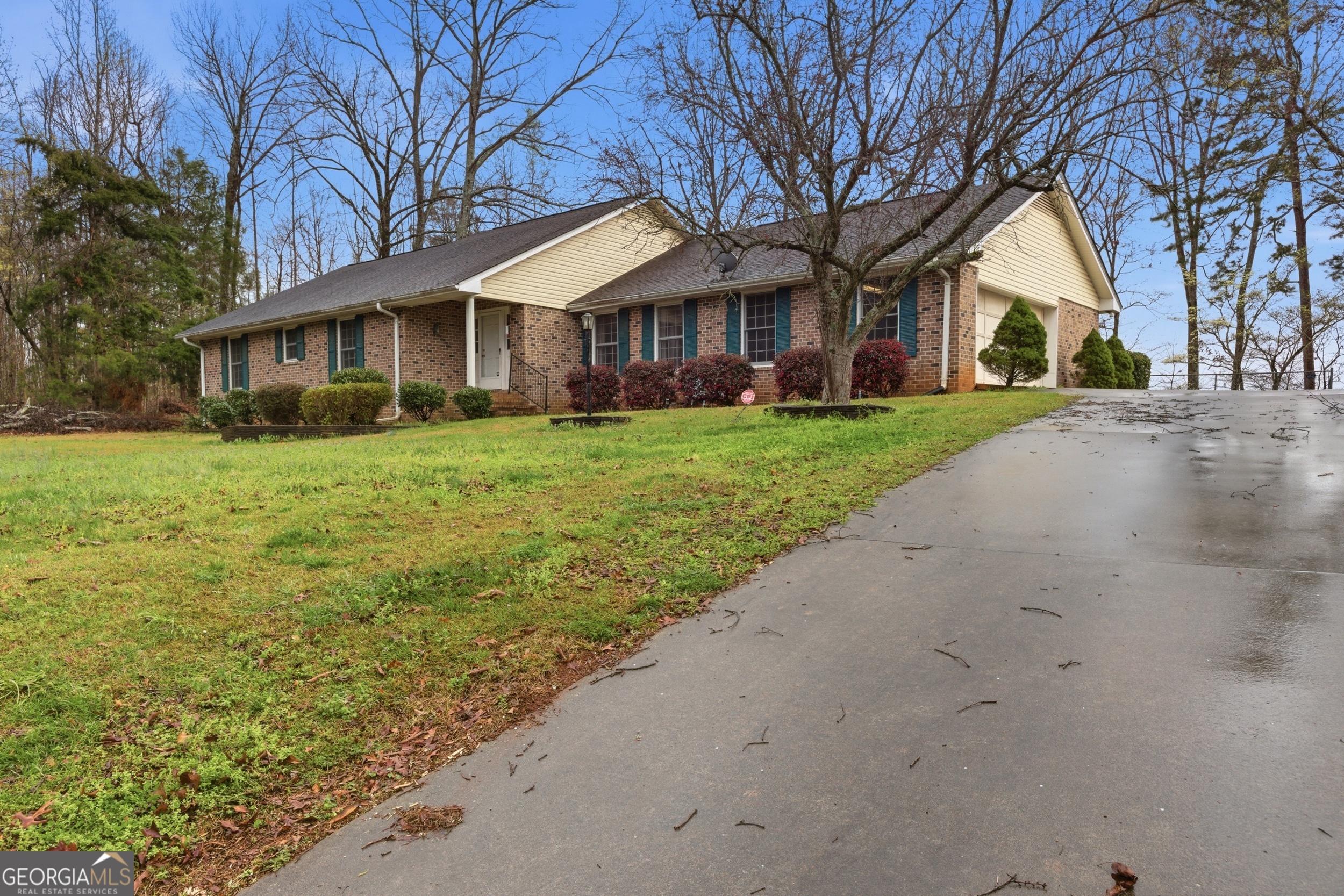 304 Beaverbrook Drive Toccoa, GA 30577 - Photo 11 of 53 a view of a yard in front of a house with large windows