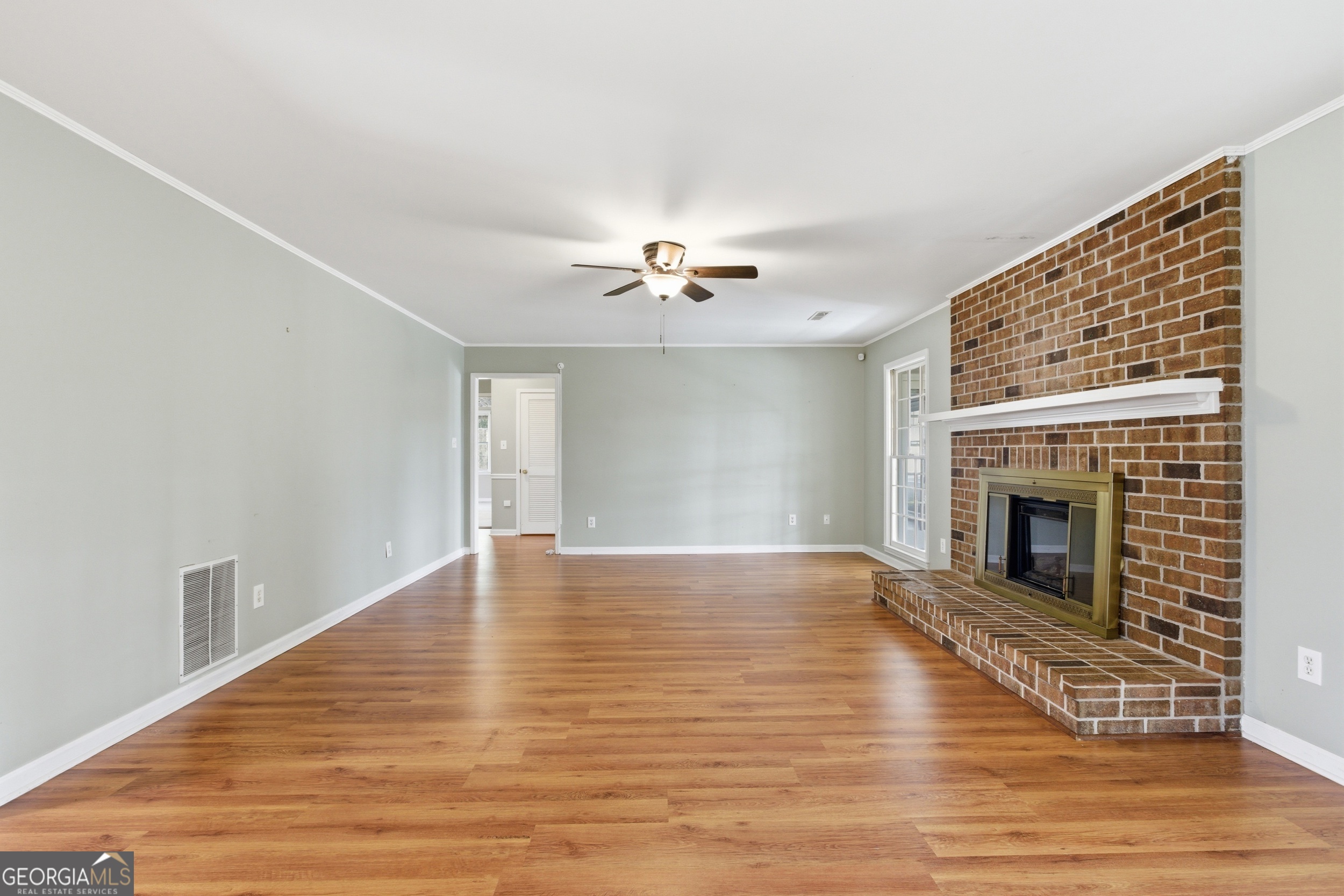 304 Beaverbrook Drive Toccoa, GA 30577 - Photo 21 of 53 a view of a livingroom with a ceiling fan fireplace and wooden floor