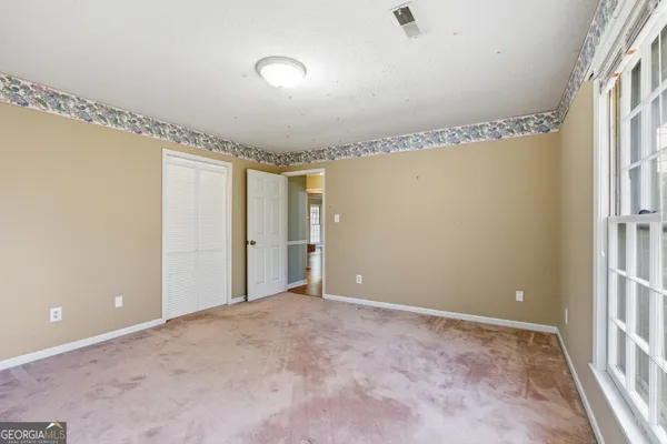 a bathroom with a tub and shower