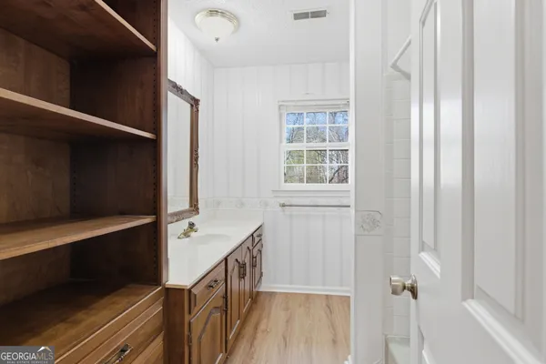 a view of an empty room with a window