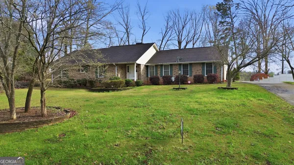 front view of a house with a yard