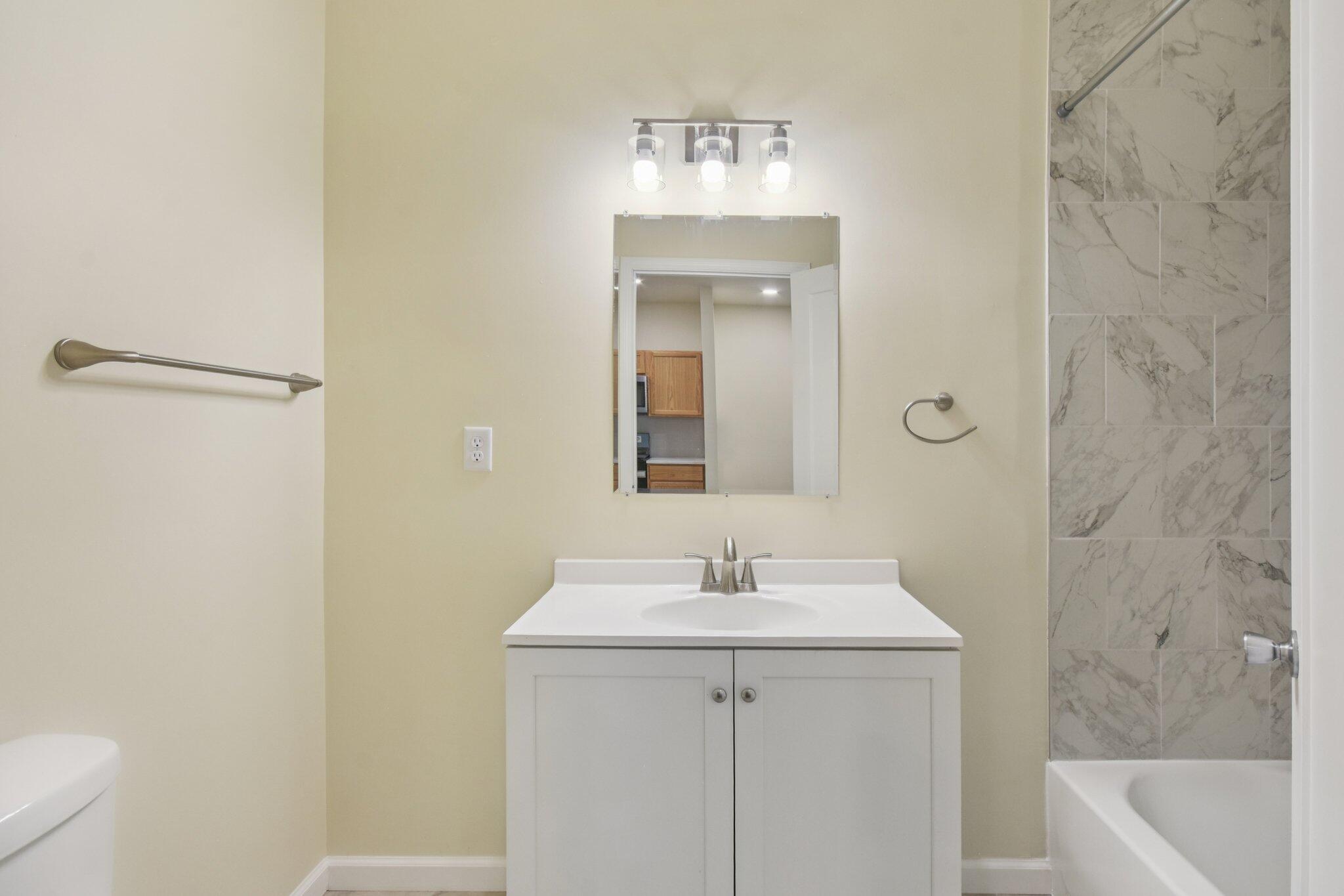 4556 Polk Street Gary, IN 46408 - Photo 13 of 22 a bathroom with a sink a toilet and shower