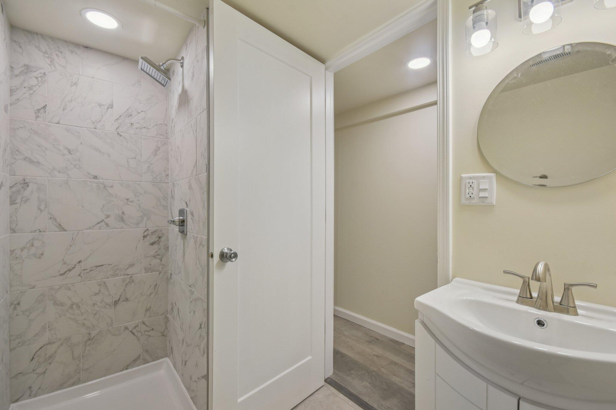 4556 Polk Street Gary, IN 46408 - Photo 19 of 22 a bathroom with a sink and a mirror