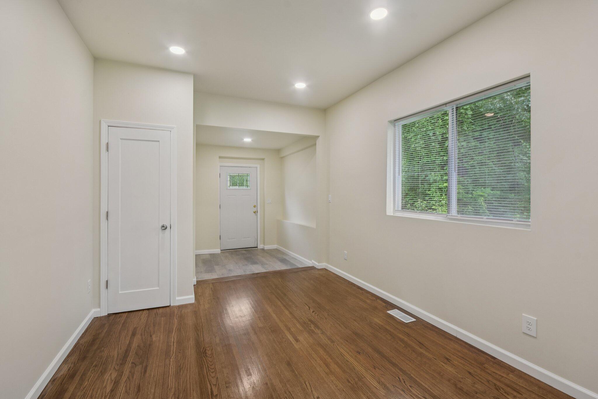 4556 Polk Street Gary, IN 46408 - Photo 4 of 22 a view of a room with wooden floor and window
