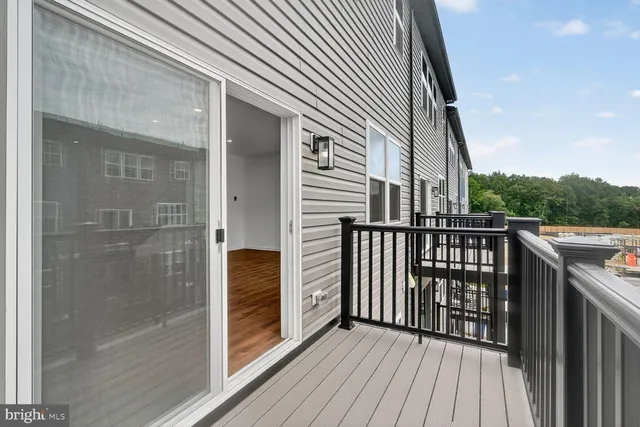a balcony with wooden floor