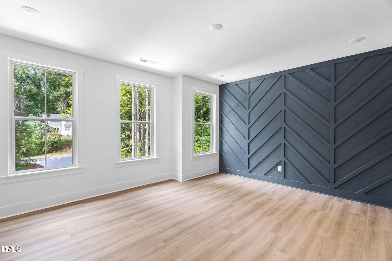 712 Oaks Lane Road Timberlake, NC 27583 - Photo 19 of 49 a view of an empty room with wooden floor and a window