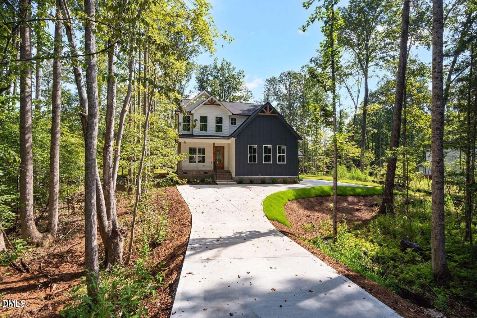 712 Oaks Lane Road Timberlake, NC 27583 - Photo 2 of 49 a swimming pool with outdoor seating and yard