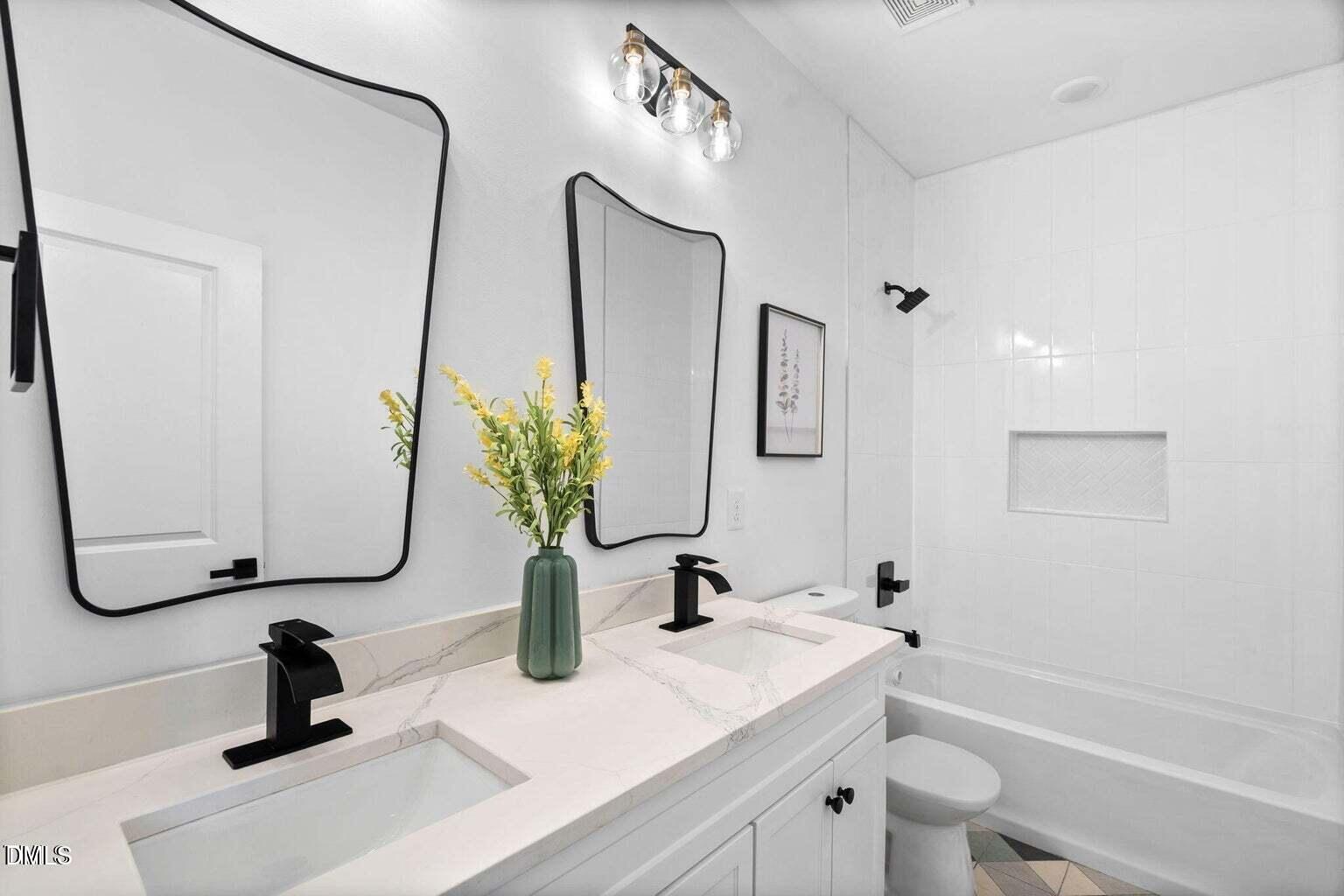 712 Oaks Lane Road Timberlake, NC 27583 - Photo 34 of 49 a bathroom with a sink and a mirror