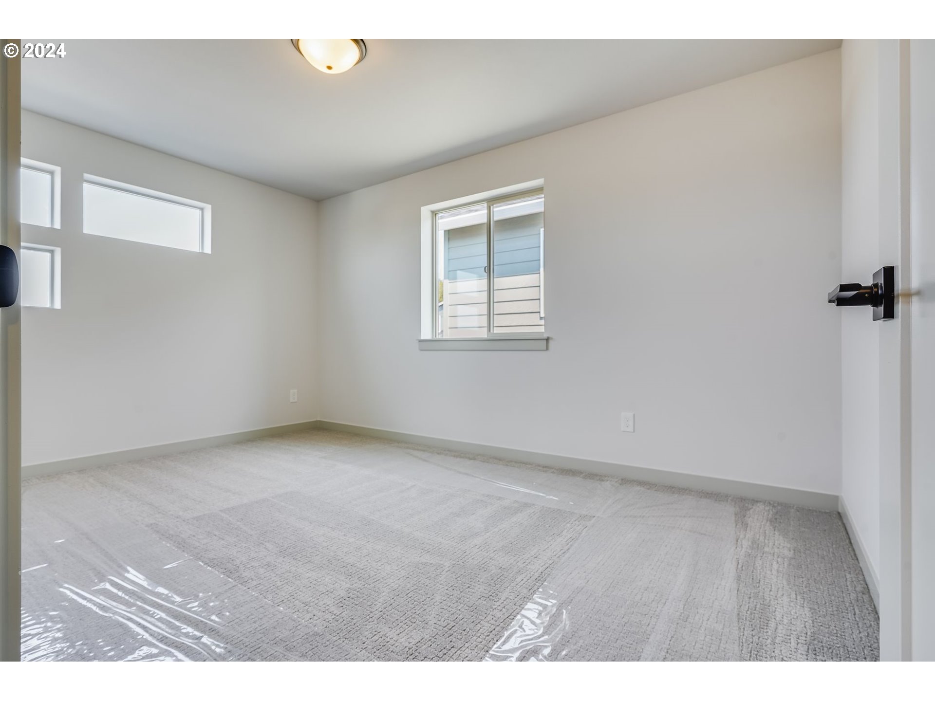 715 Northwest 174th Street Ridgefield, WA 98642 - Photo 18 of 20 a view of an empty room with a window