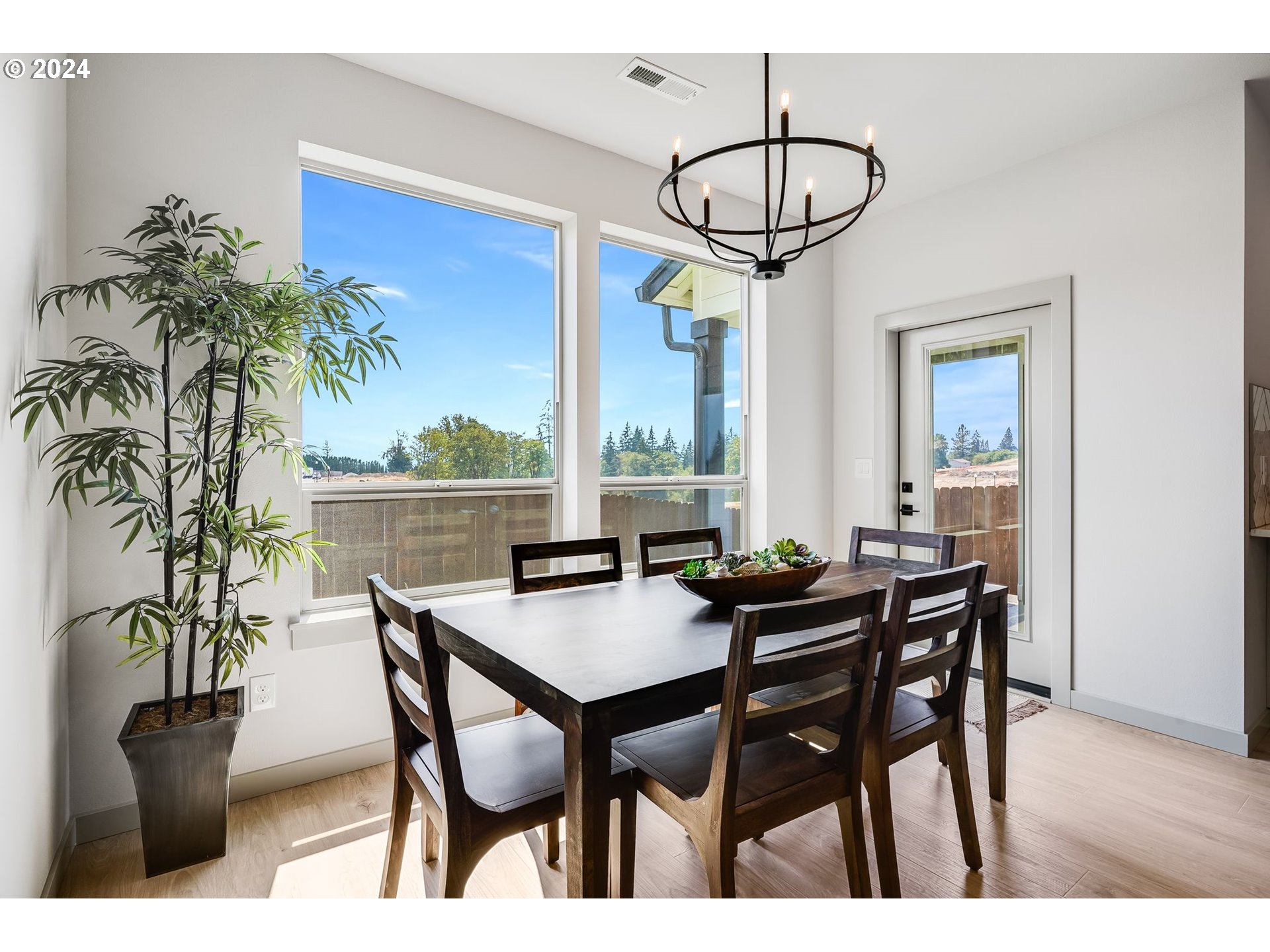 715 Northwest 174th Street Ridgefield, WA 98642 - Photo 7 of 20 a view of a dining room with furniture and a chandelier