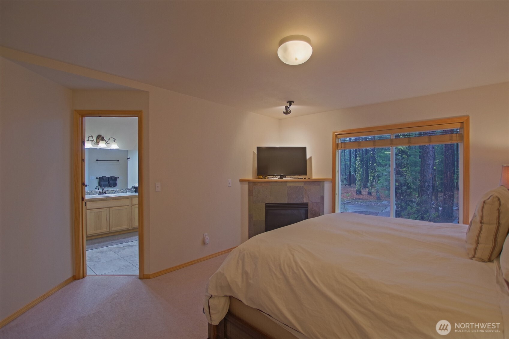 140 Evergreen Valley Loop Road Ronald, WA 98940 - Photo 16 of 37 a bedroom with a bed and a view of kitchen