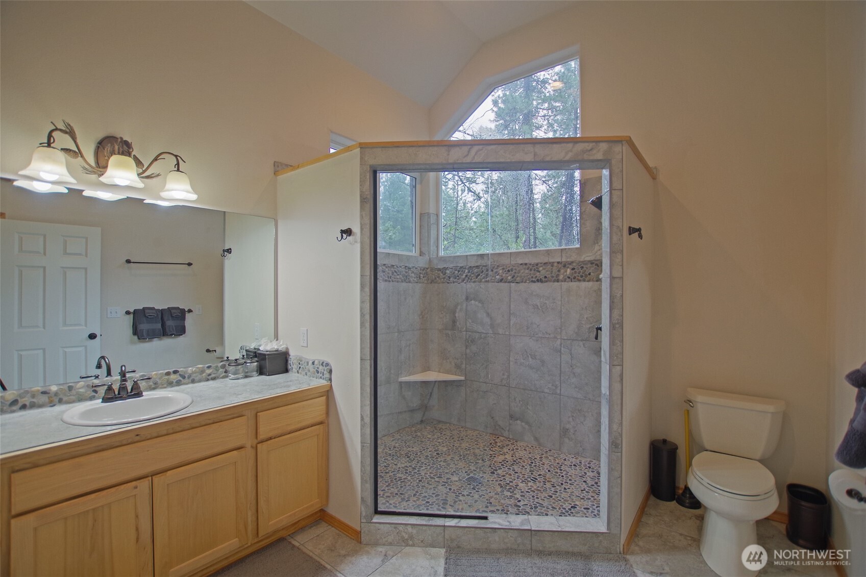 140 Evergreen Valley Loop Road Ronald, WA 98940 - Photo 17 of 37 a bathroom with a granite countertop sink toilet a mirror a vanity and shower