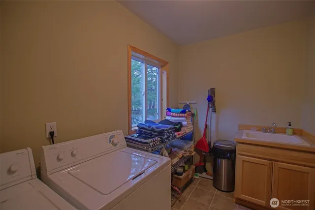 a bathroom with a sink toilet and a mirror