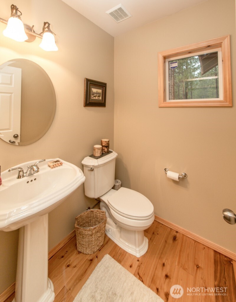 140 Evergreen Valley Loop Road Ronald, WA 98940 - Photo 21 of 37 a bathroom with a sink toilet and a mirror