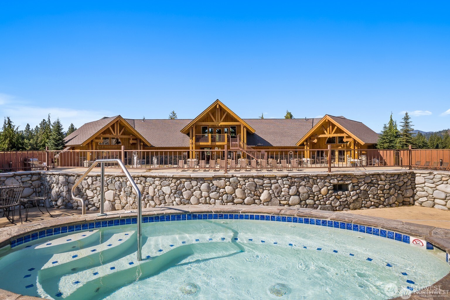 140 Evergreen Valley Loop Road Ronald, WA 98940 - Photo 35 of 37 a view of a wooden house with a small yard and wooden fence