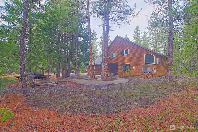 a backyard of a house with outdoor seating