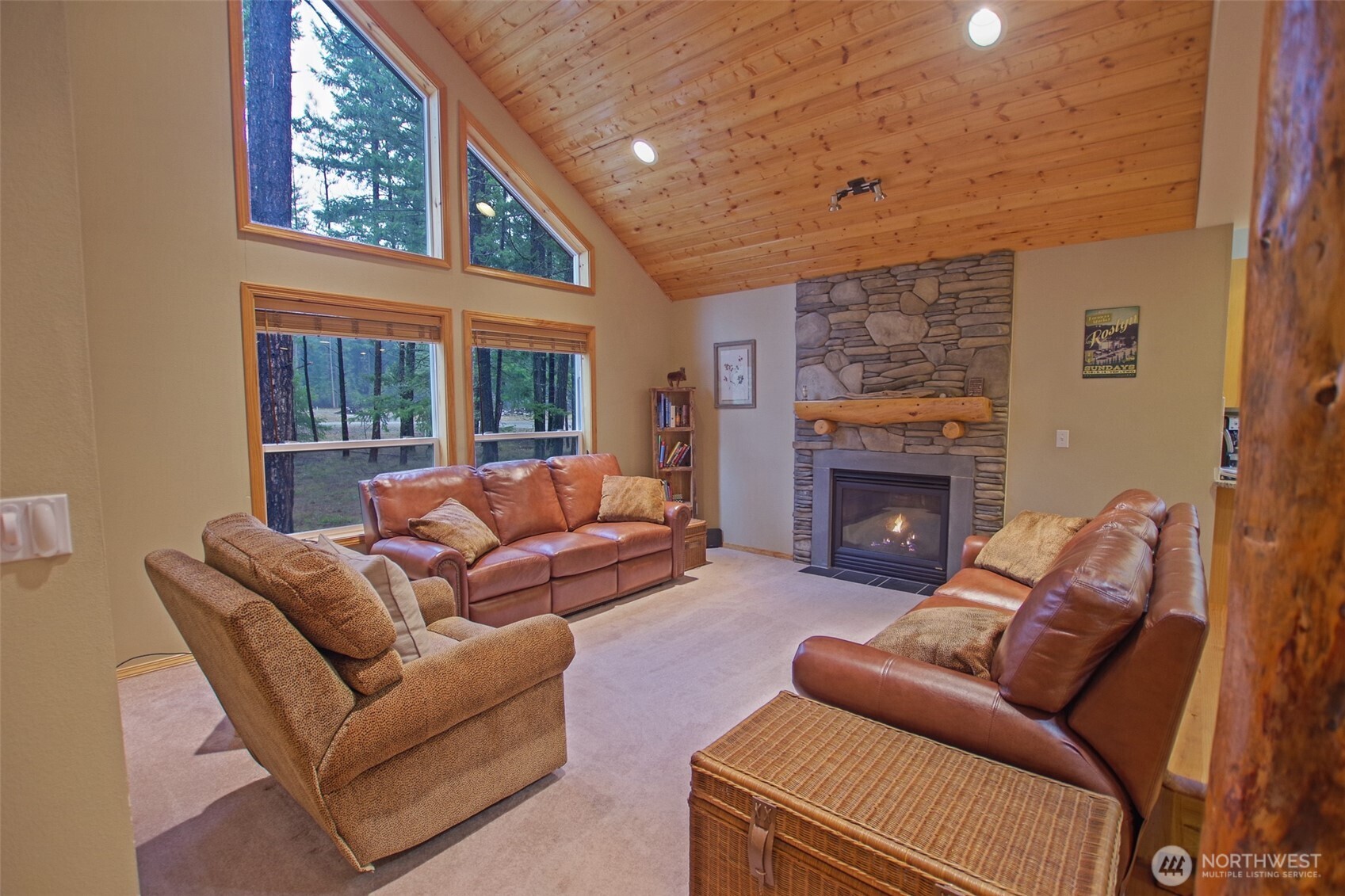 140 Evergreen Valley Loop Road Ronald, WA 98940 - Photo 5 of 37 a living room with furniture a large window and a fireplace