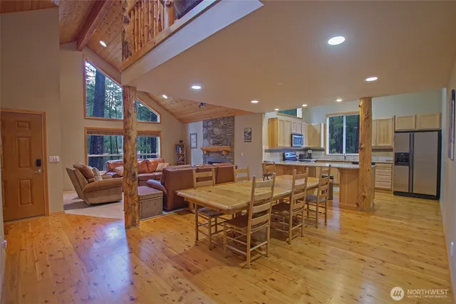 a living room with furniture a ceiling fan and a window