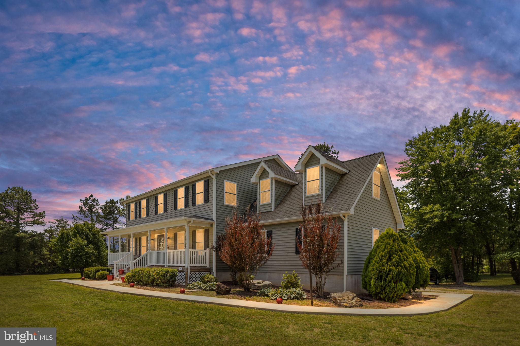 22088 Landora Bridge Road Ruther Glen, VA 22546 - Photo 3 of 122 Charming home under a vibrant sky.