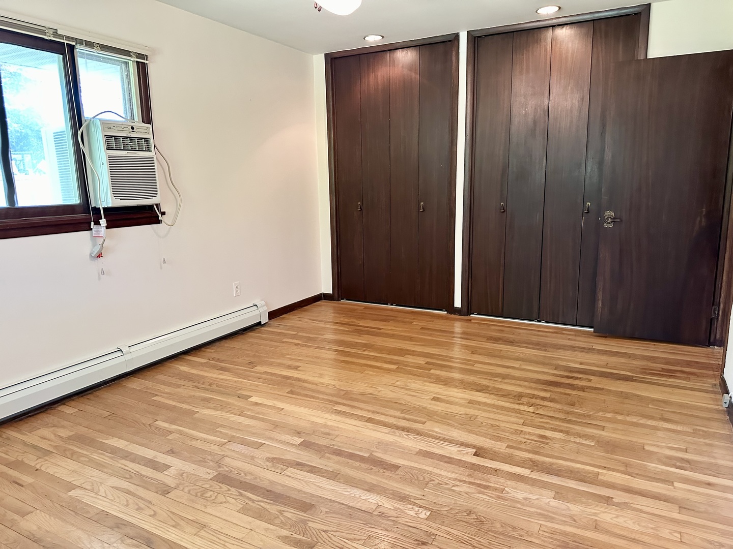 1453 North 2401st Road Ottawa, IL 61350 - Photo 13 of 26 a view of an empty room with wooden floor