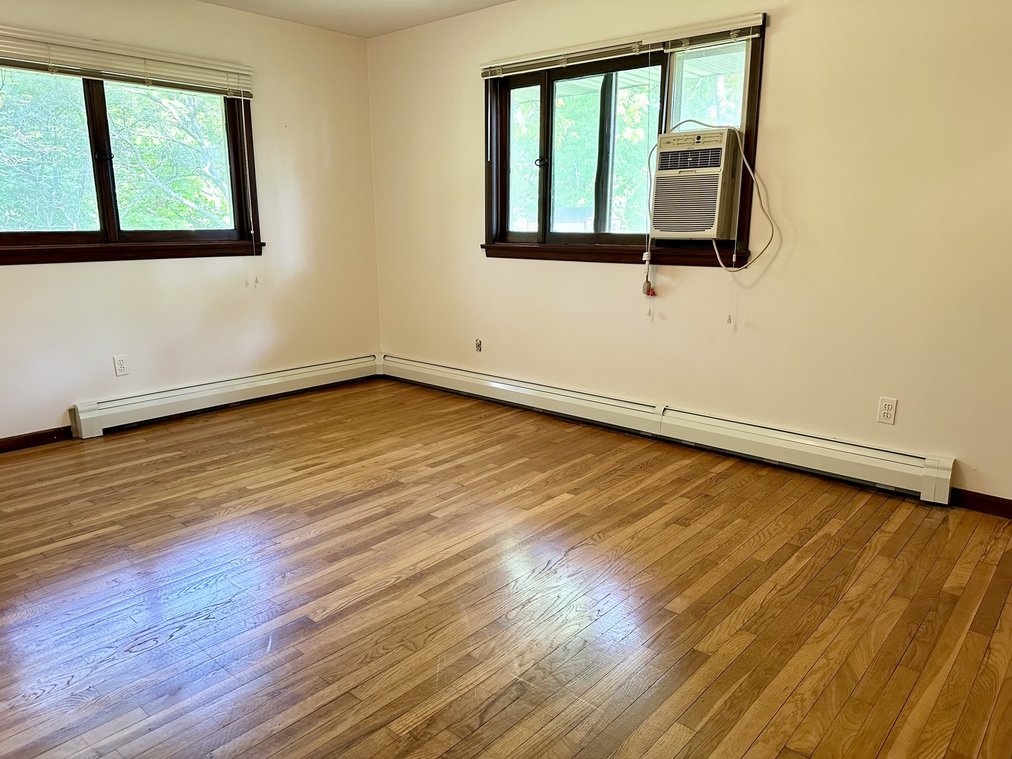 1453 North 2401st Road Ottawa, IL 61350 - Photo 14 of 26 a view of an empty room with wooden floor and a window