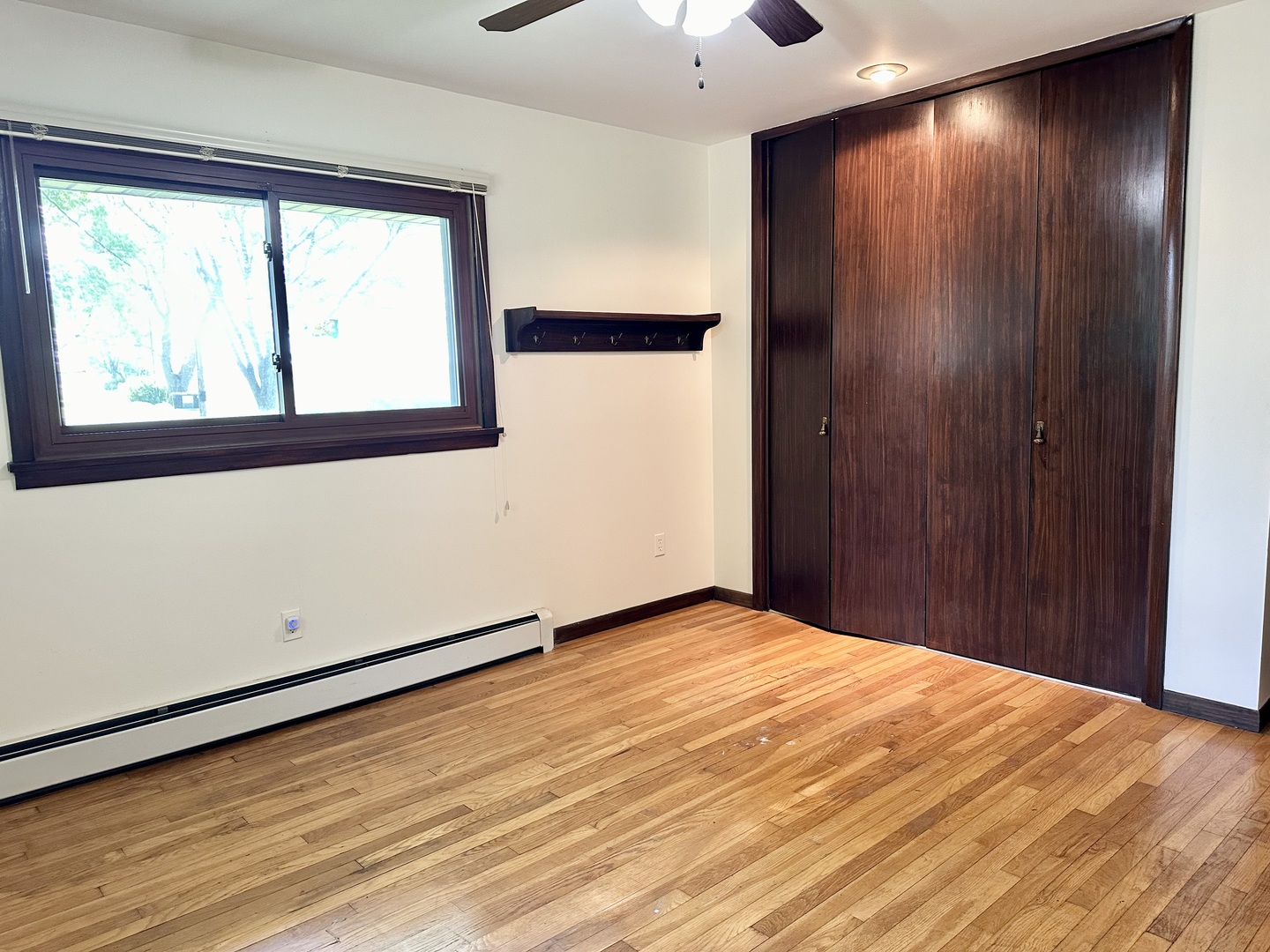 1453 North 2401st Road Ottawa, IL 61350 - Photo 15 of 26 an empty room with wooden floor and windows