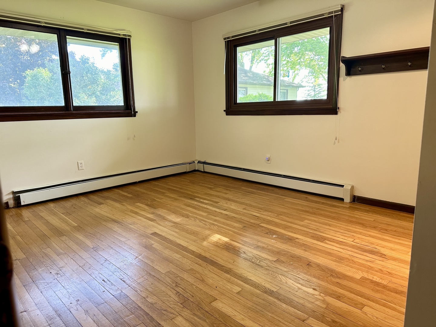 1453 North 2401st Road Ottawa, IL 61350 - Photo 16 of 26 a view of an empty room with wooden floor and a window