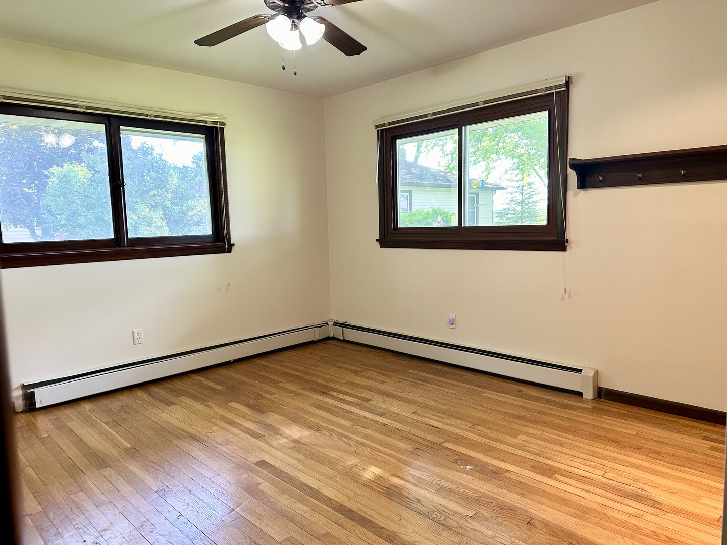 1453 North 2401st Road Ottawa, IL 61350 - Photo 17 of 26 a view of an empty room with wooden floor and a window
