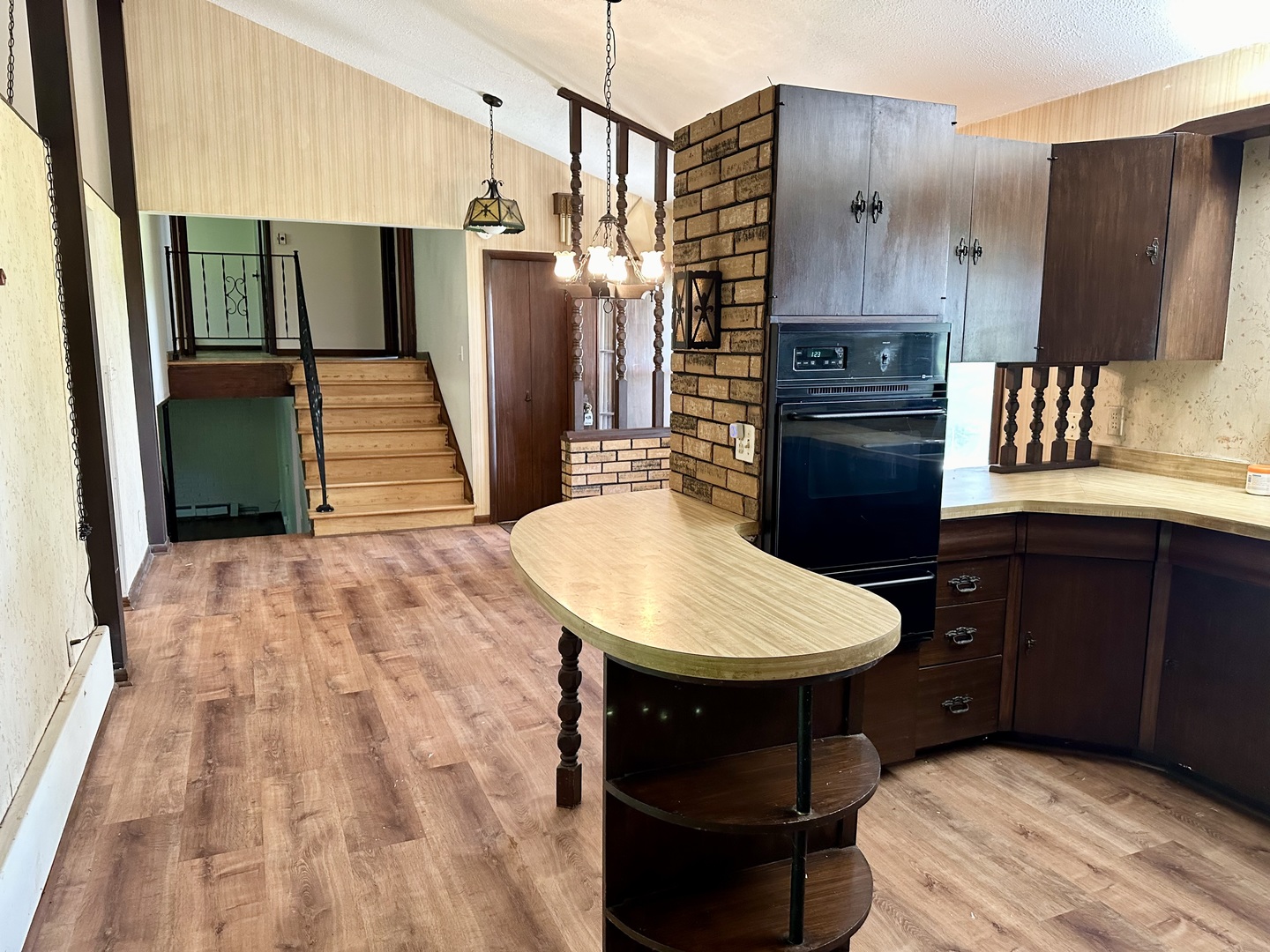 1453 North 2401st Road Ottawa, IL 61350 - Photo 6 of 26 a kitchen with stainless steel appliances a sink cabinets and wooden floor