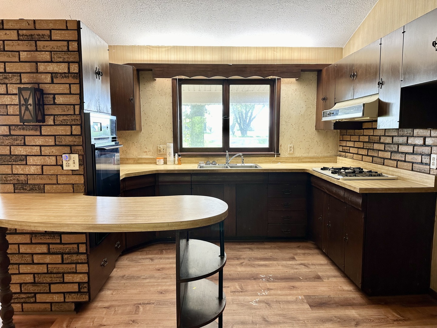 1453 North 2401st Road Ottawa, IL 61350 - Photo 7 of 26 a kitchen with a sink and a refrigerator