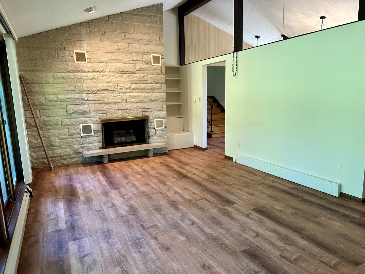 1453 North 2401st Road Ottawa, IL 61350 - Photo 8 of 26 a view of empty room with wooden floor and fireplace