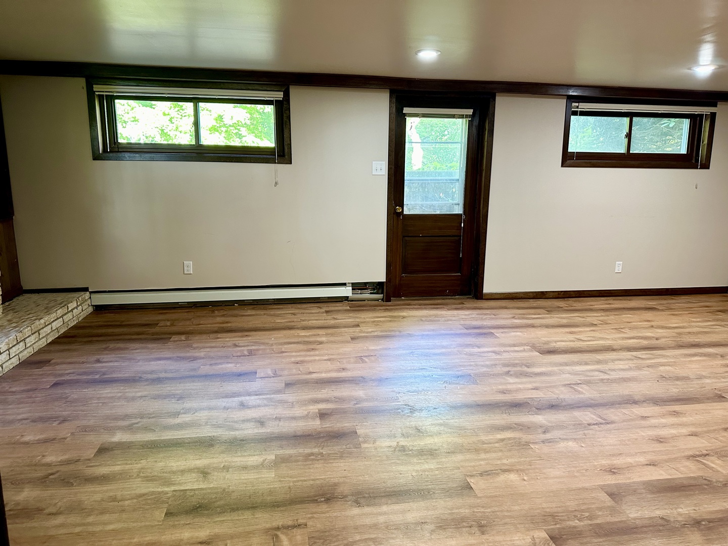 1453 North 2401st Road Ottawa, IL 61350 - Photo 10 of 26 a view of an empty room with wooden floor and a window