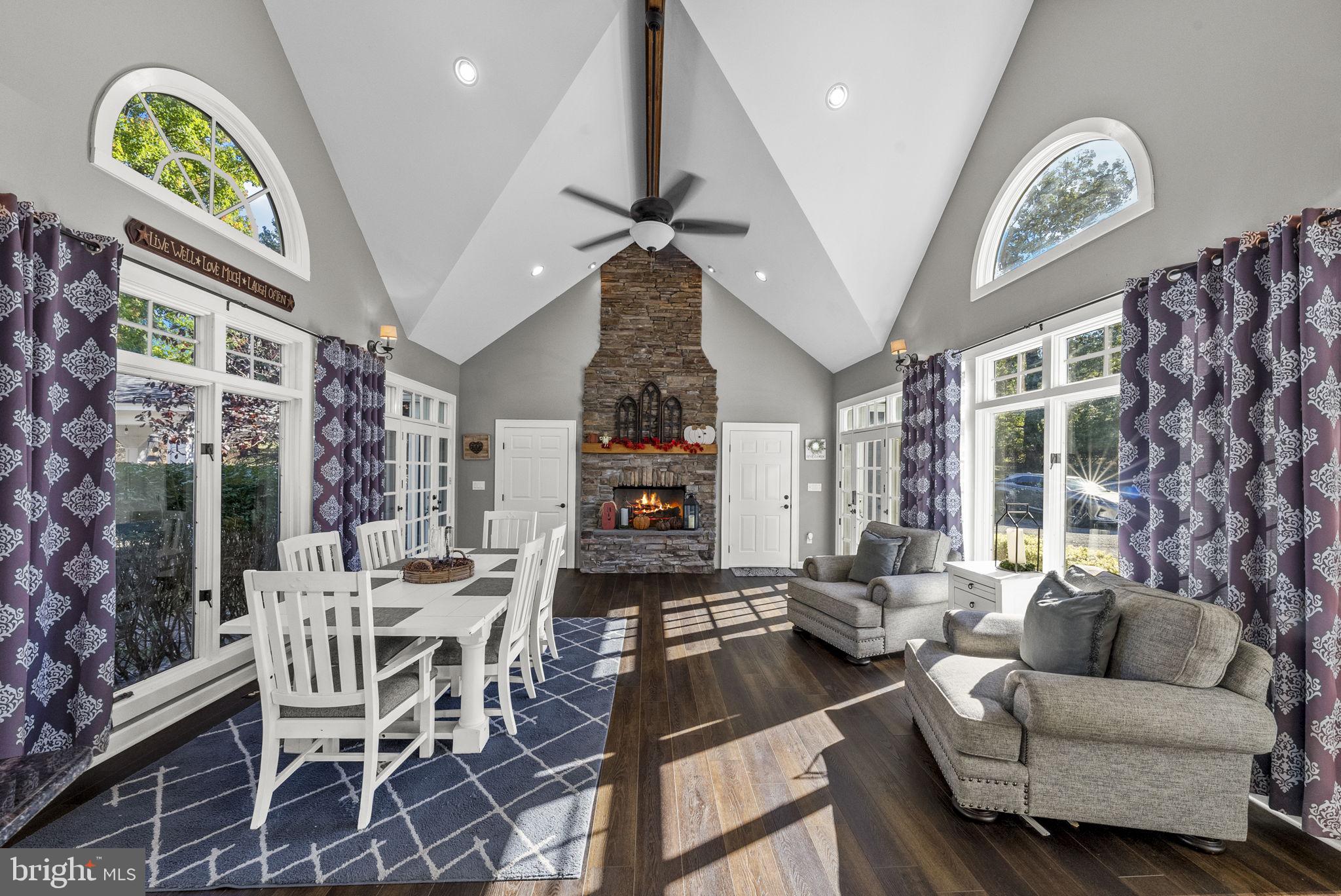 623 Montgomery Road Hillsborough, NJ 08844 - Photo 16 of 67 a living room with furniture a chandelier and a large window