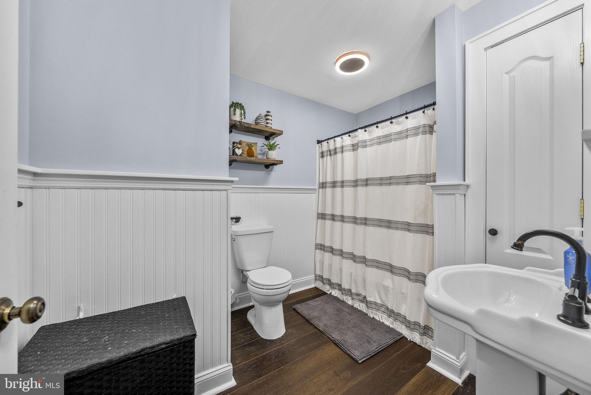 623 Montgomery Road Hillsborough, NJ 08844 - Photo 21 of 67 a bathroom with a sink a toilet and shower