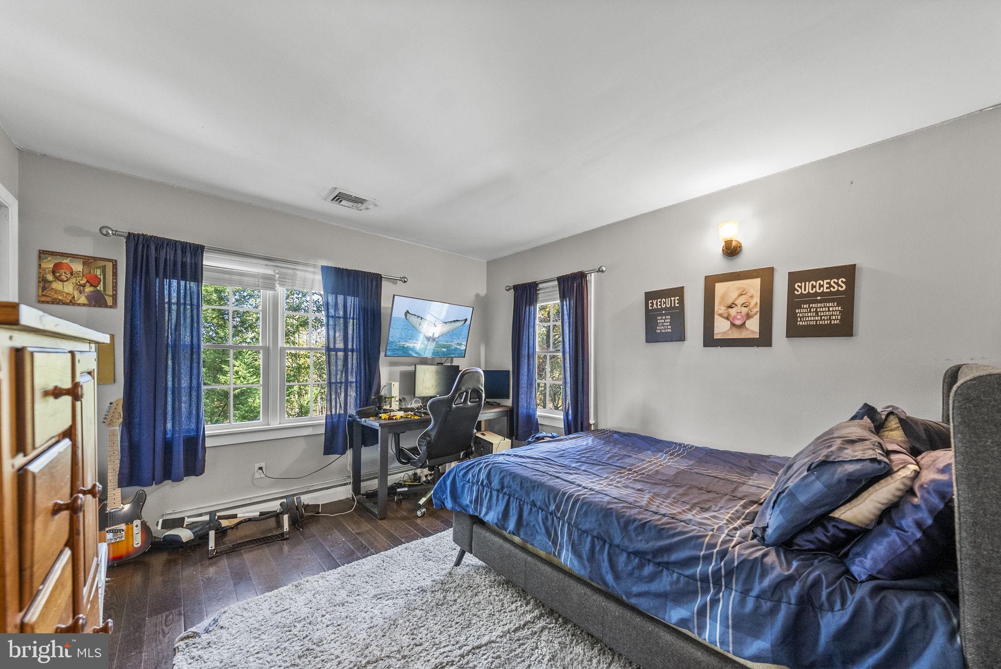 623 Montgomery Road Hillsborough, NJ 08844 - Photo 34 of 67 a bedroom with a bed and large windows