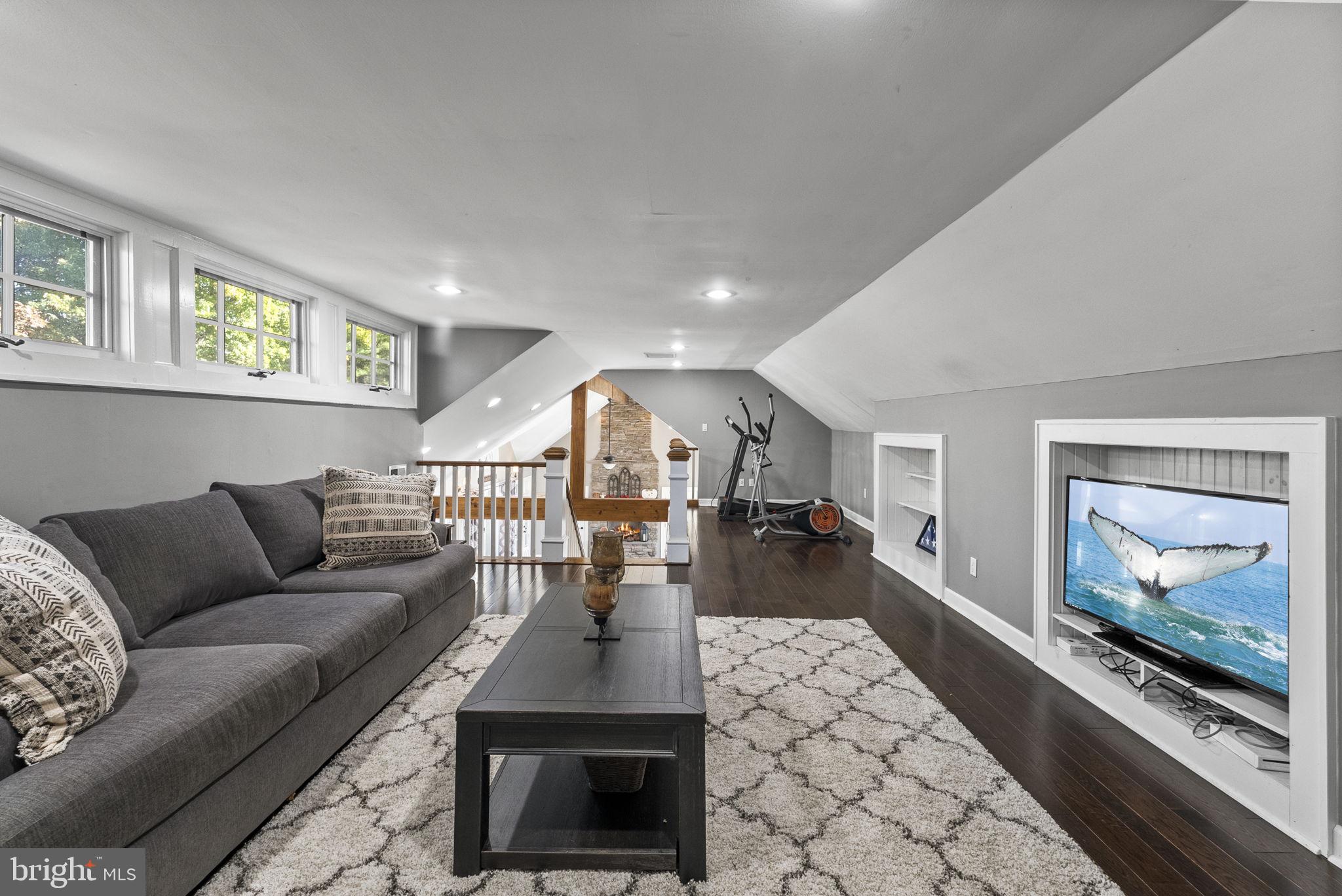 623 Montgomery Road Hillsborough, NJ 08844 - Photo 43 of 67 a living room with furniture and a fireplace
